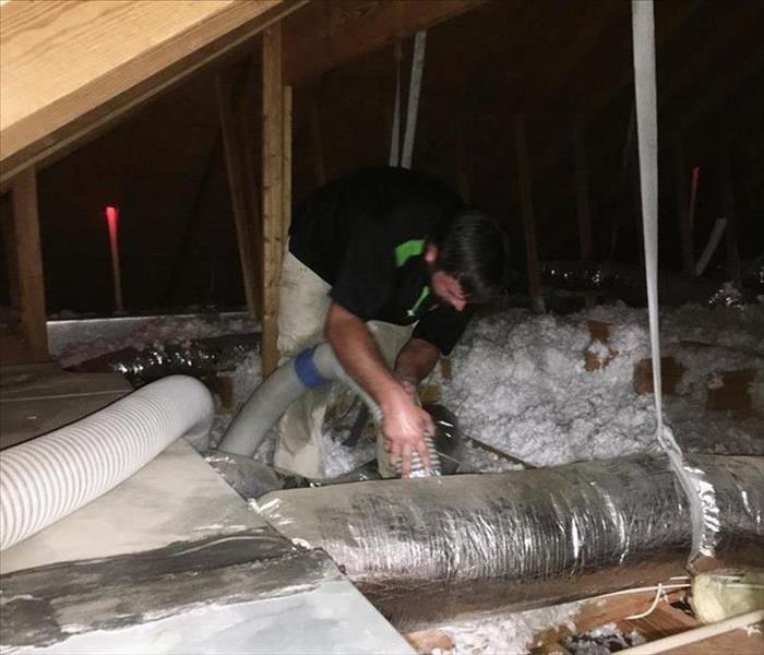 Removing insulation in an attic